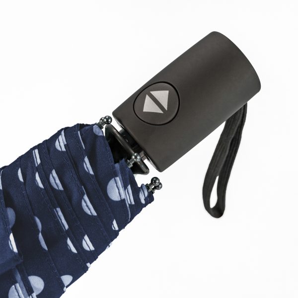 Compact navy umbrella with polka dot pattern and automatic open-close feature.